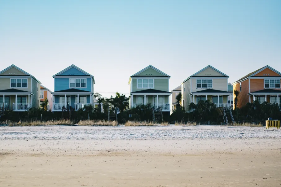 five assorted-color 2-storey houses